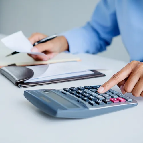 Woman calculating bills.