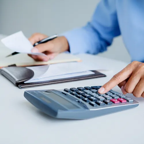 Woman calculating bills.