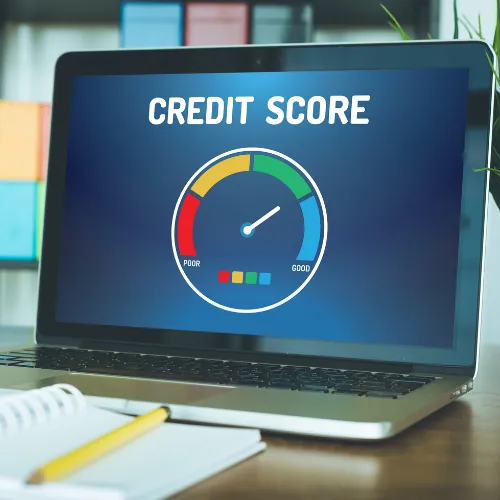 Laptop with credit score ranking on screen.