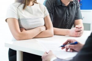 divorcing couple discussing how much divorce mediation costs